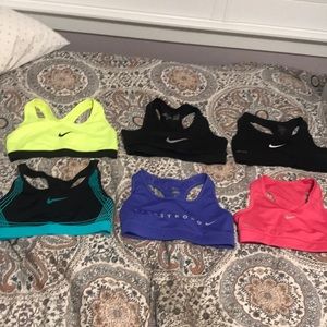 Six Nike sports bras